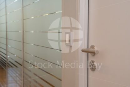 door to conference room in office building - modern light glass