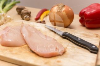 Cutting chicken meat - preparing food - dinner lunch eating kitchen